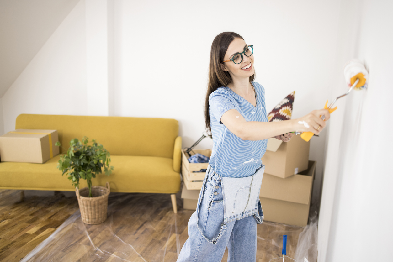 woman painting the wall